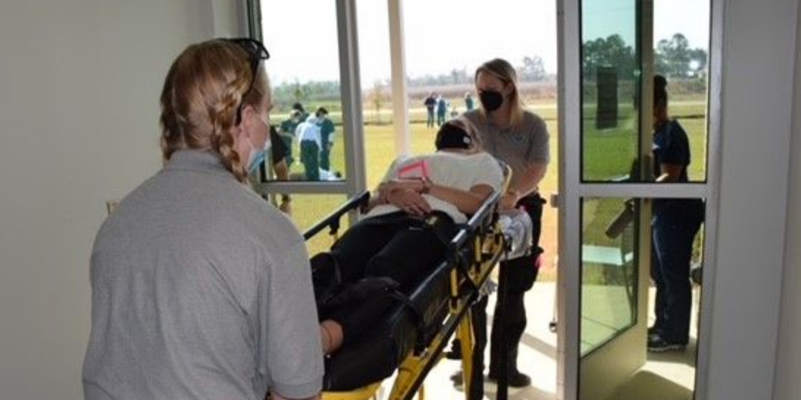ems students performing training simulation