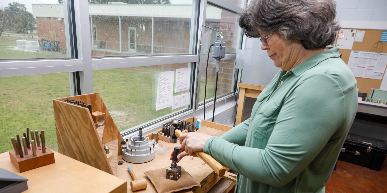 a woman working on creative arts at southport center