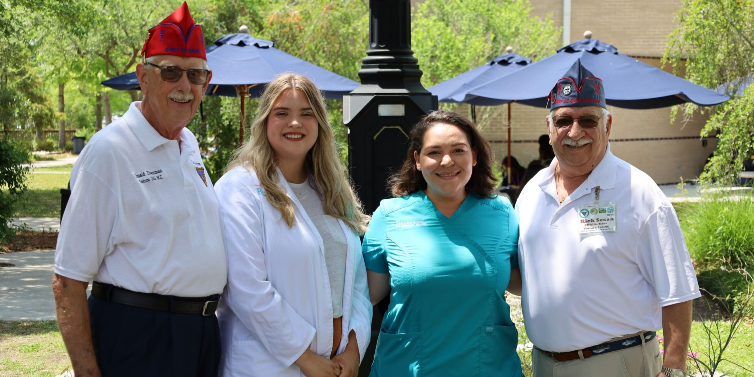 veterans presenting nursing students with scholarship