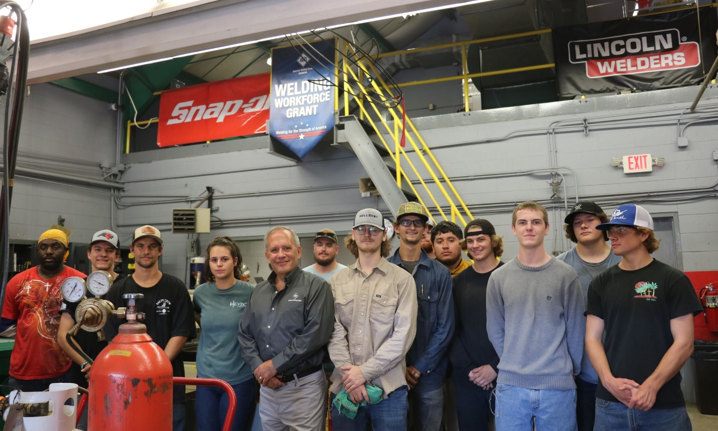 welding students and instructions pictured with AWS rep