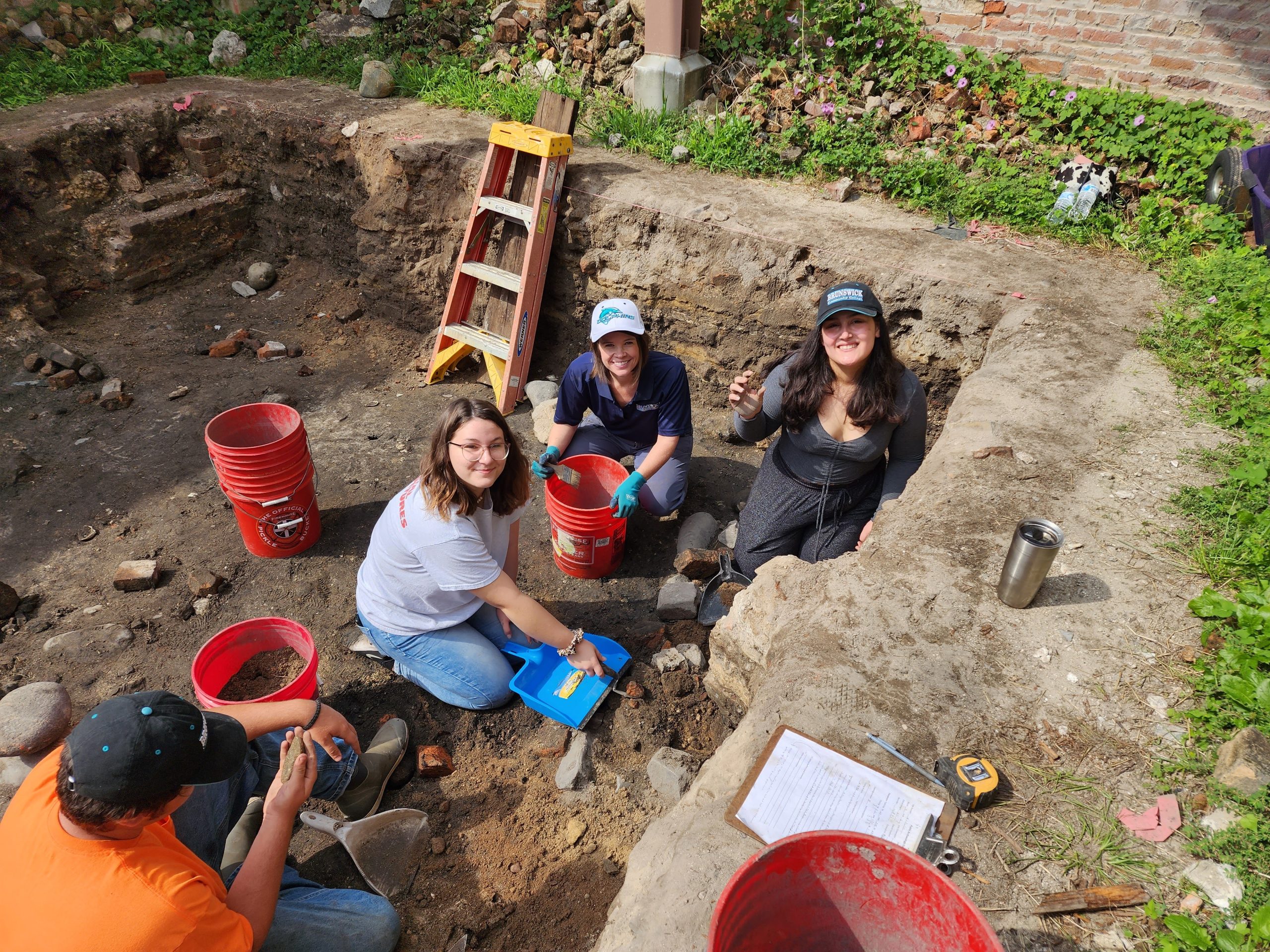 BCC instructor and students at an offsite field trip to an archeological dig