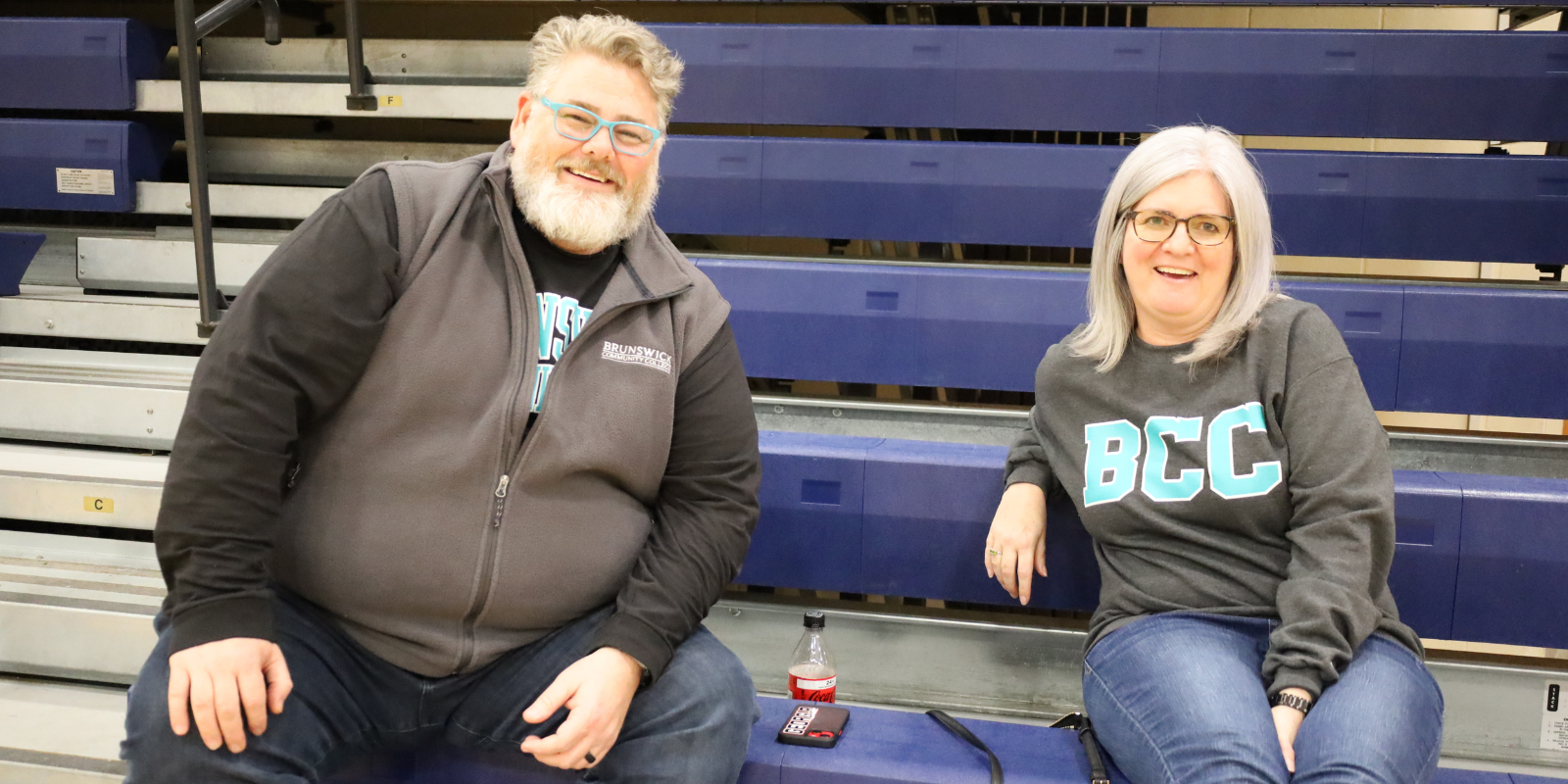 Two employees at BCC Basketball Game