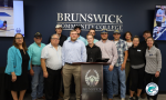 the fourth graduating class and instructors from BCC's Electrical Lineworker Program